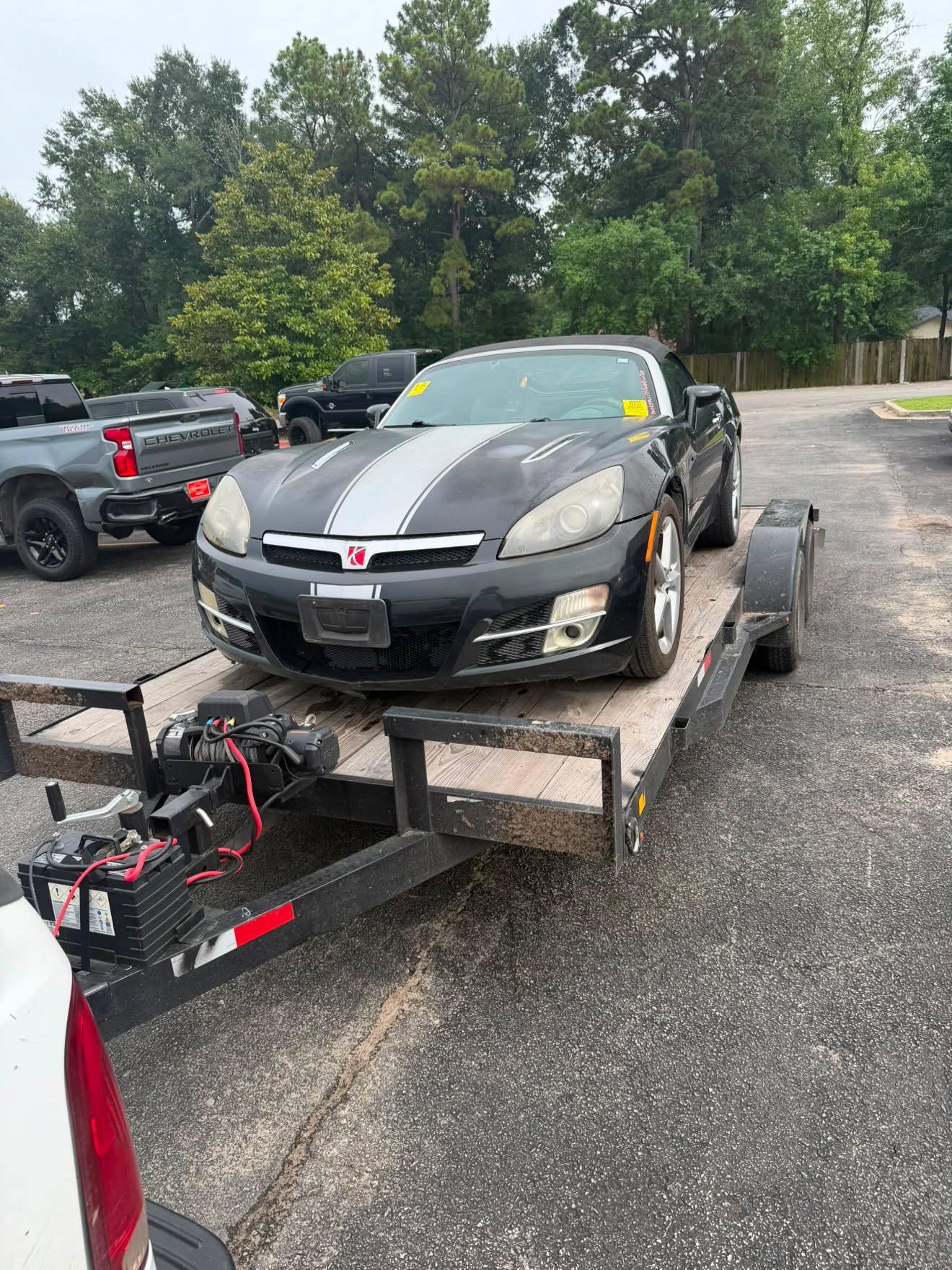 Saturn Sky convertible secured on a Masterkey Transport trailer for vehicle transport